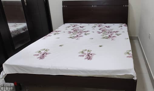 Queen-size cot with mattress