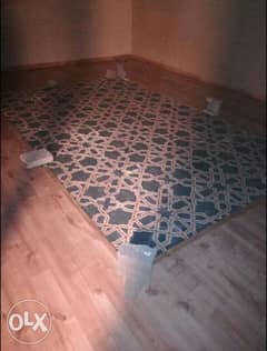 Wood flooring with carpet frame decorations