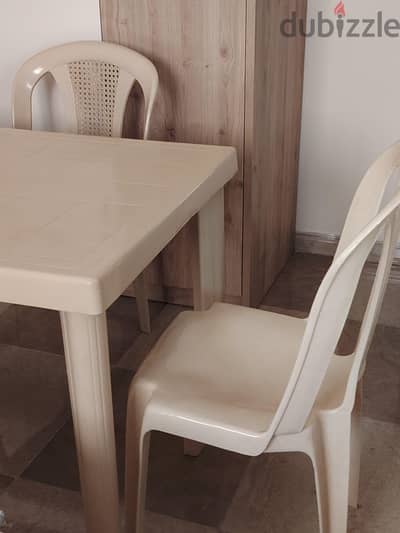 Plastic table with 3 chairs