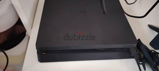 PS4 with 3 controllers and 7 games