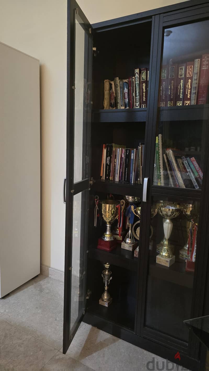 Black , sleek ,wooden bookshelf/ cupboard 1