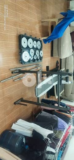 zym table and 50 kg dumbells  superb condition 0