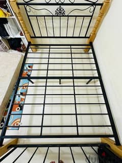 King Size Cot Steel frame with wooden legs at 200 QAR