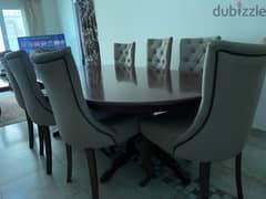 Elegant Oval Wooden Dining Table with 8 Tufted Chairs
